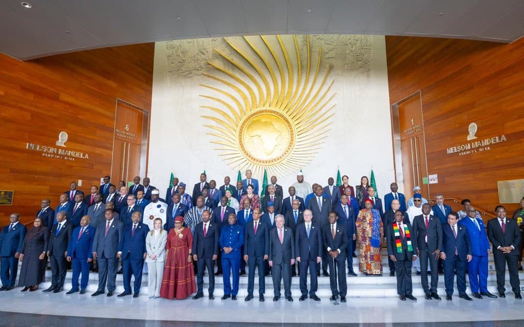 A large group of African heads of state and officials posing for a photo at the African Union headquarters