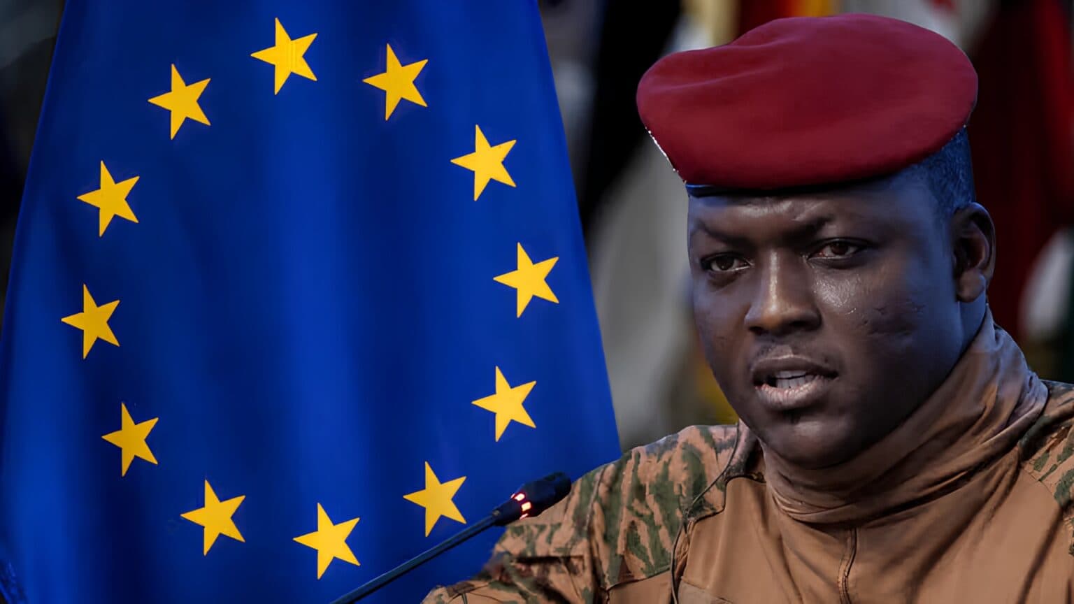 A Burkina Faso military official speaking at a podium beside a European Union flag