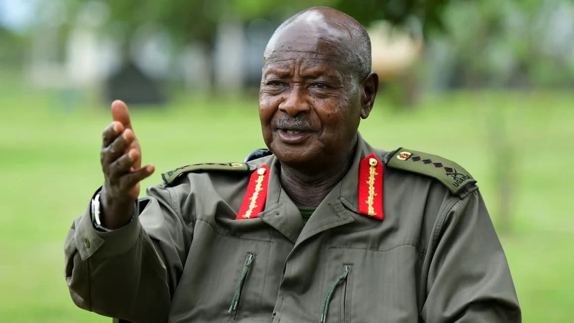 Ugandan President Yoweri Museveni in military uniform gesturing while speaking outdoors